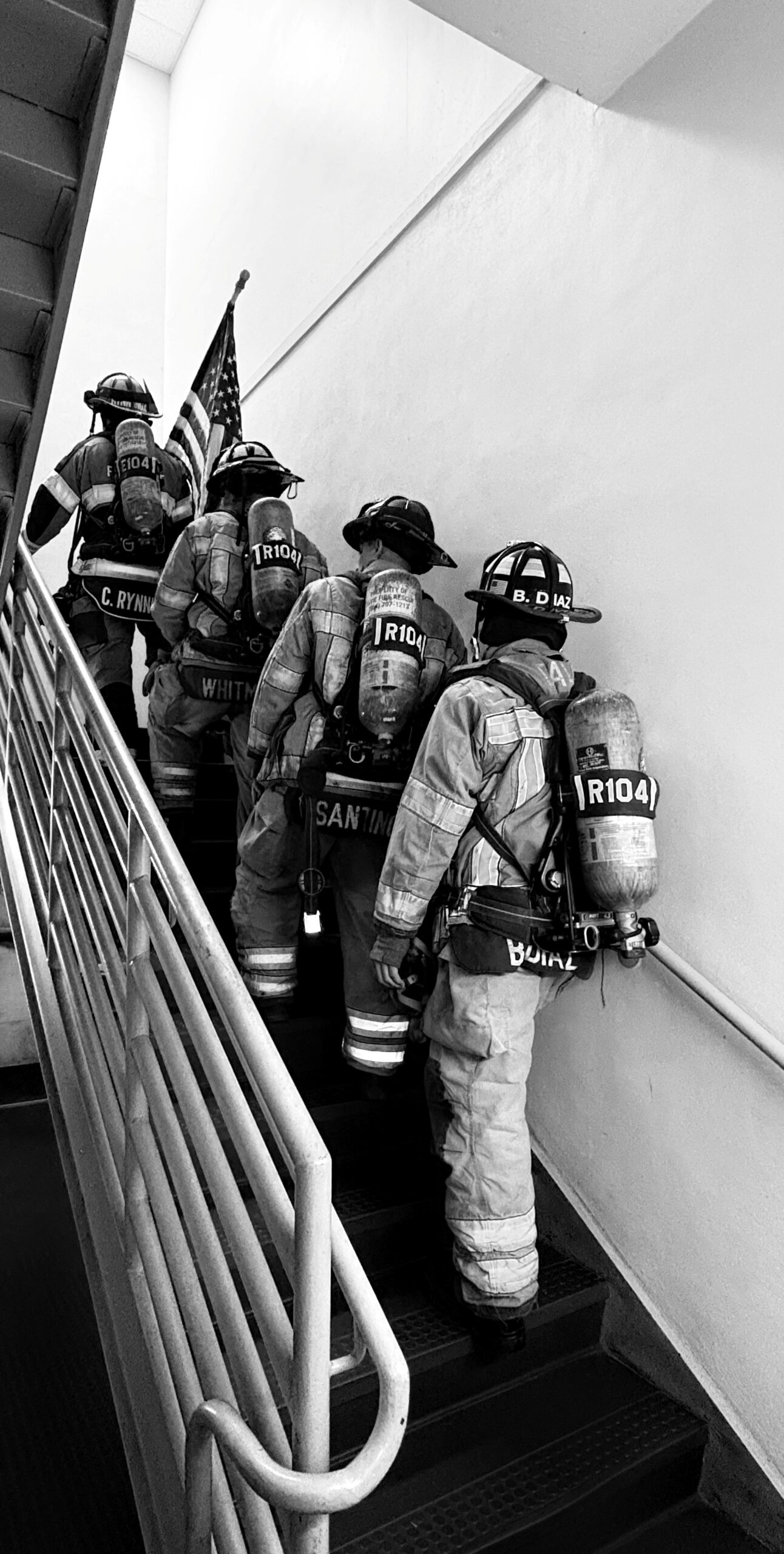 Firemen in Stairwell Black and White