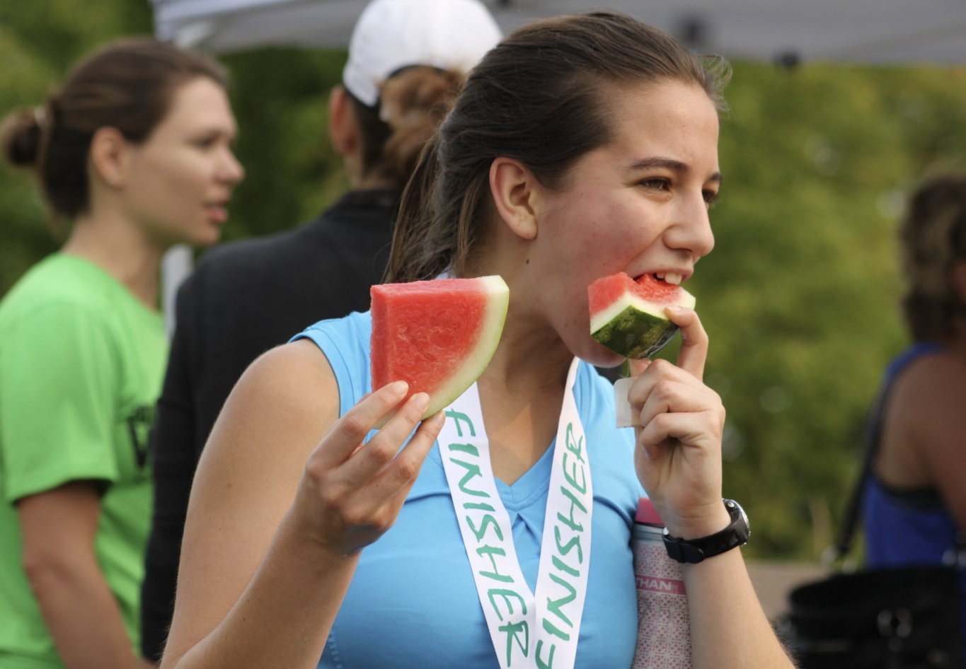 Girl Eating Watermelon with Finisher Medal